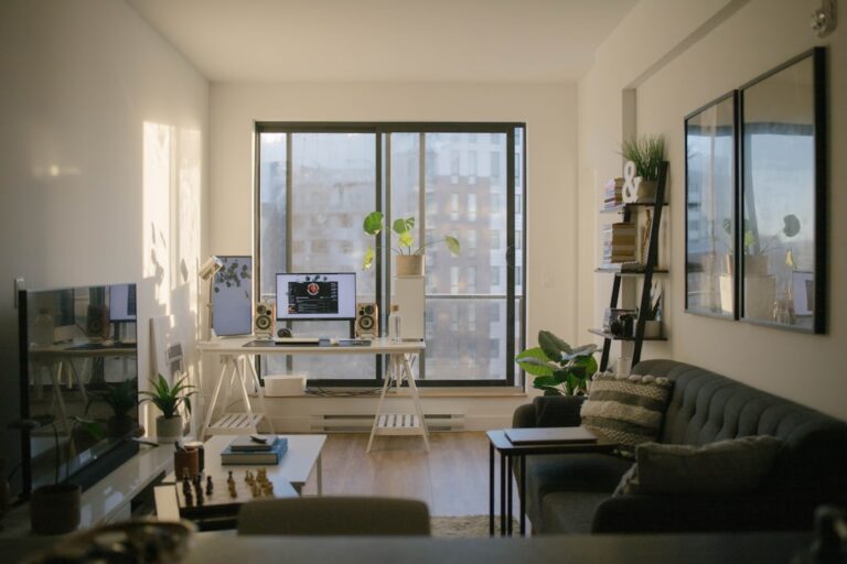 black leather sofa near glass window — Photo by Med Badr Chemmaoui on Unsplash